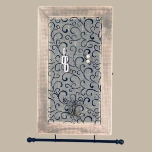Hand-painted Jewelry Cabinet - Heart Swirl Design on a white distressed solid wood case with a decorative fiberglass screen door as the earring holder surface. Interior jewelry hooks are included (not visible) and a matching jewelry bar hangs from the case.