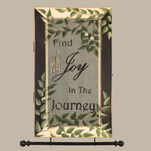 Hand-painted Jewelry Cabinet - Joy in the Journey Design on a white distressed solid wood case with a decorative fiberglass screen door as the earring holder surface. Interior jewelry hooks are included (not visible) and a matching jewelry bar hangs from the case.