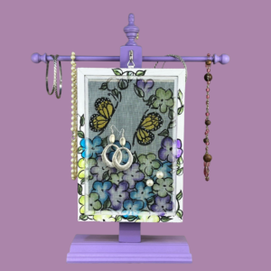 Hand-painted Earring Holder with Butterflies Design — solid wood purple and white solid wood frame with fiberglass screen earring display area hanging on necklace stand. Handmade in Michigan.