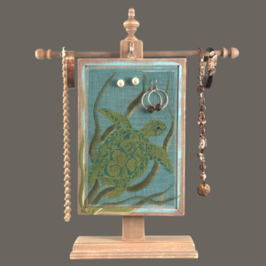 Hand-painted Earring Holder — Sea Turtles Design on weathered gray wood frame and fiberglass earring display screen hanging on a matching necklace stand. Handmade in Michigan.