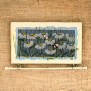 Hand-painted Studio Series Daisies Design on a white distressed solid wood frame and a decorative fiberglass screen as the earring display surface.