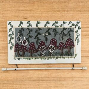 Hand-painted Studio Series Mushrooms Jewelry Organizer – distressed white wood frame with color coordinated jewelry bar.