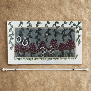 Hand-painted Mushrooms Deluxe Jewelry Organizer – distressed white wood frame with color coordinated jewelry bar.