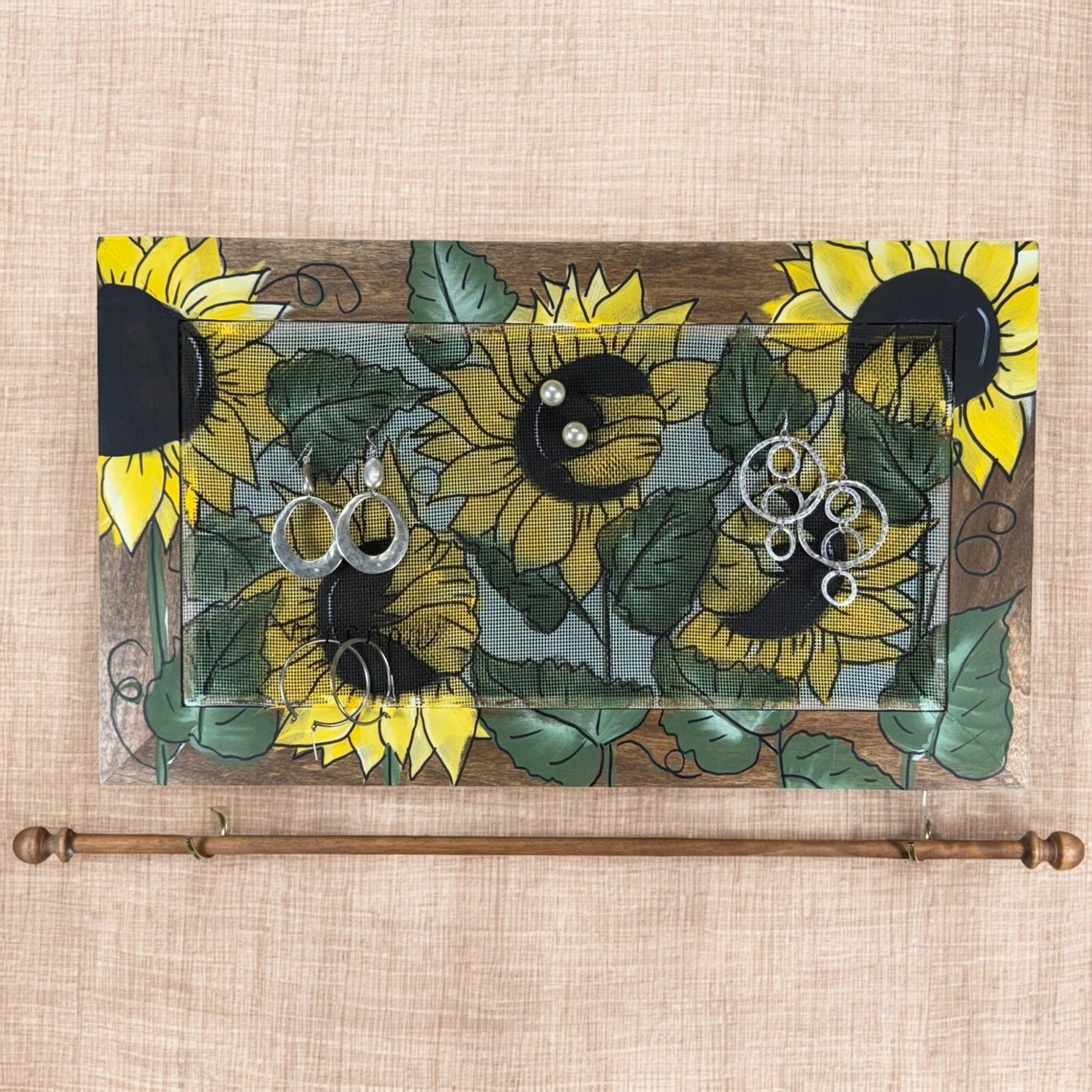 Hand-painted Studio Series Sunflowers Design on walnut stained frame with decorative fiberglass screen as the earring display surface.