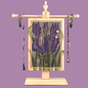 Hand-painted Earring Holder with Iris Design — solid wood white distressed solid wood frame with fiberglass screen earring display area hanging on matching necklace stand. Handmade in Michigan.