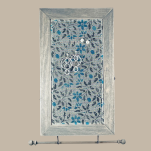 Hand-painted Jewelry Cabinet - Jacobean Design on a weathered gray solid wood case with a decorative fiberglass screen door as the earring holder surface. Interior jewelry hooks are included (not visible) and a matching jewelry bar hangs from the case.