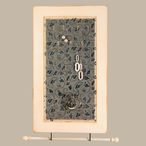 Hand-painted Jewelry Cabinet - Swirl Design on a white distressed solid wood case with a decorative fiberglass screen door as the earring holder surface. Interior jewelry hooks are included (not visible) and a matching jewelry bar hangs from the case.