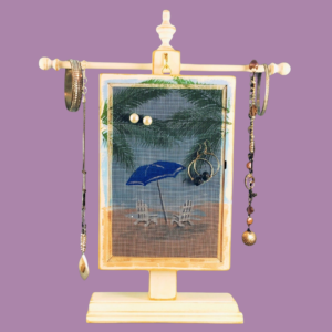 Hand-painted Earring Holder with Beach Umbrella Design — white distressed wood frame with fiberglass screen earring display area hanging on matching necklace stand. Handmade in Michigan.