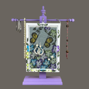 Hand-painted Earring Holder with Butterflies Design — solid wood purple frame with fiberglass screen earring display area hanging on matching necklace stand. Handmade in Michigan.