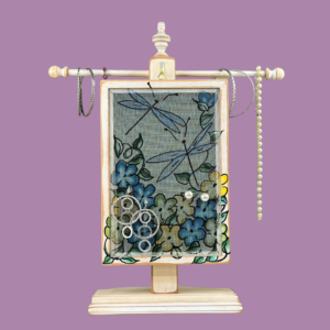 Hand-painted Earring Holder with Dragonflies Design — white distressed wood frame with fiberglass screen earring display area hanging on matching necklace stand. Handmade in Michigan.