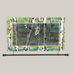 Hand painted jewelry organizer Studio Series Birch Trees Design with jewelry bar hanging from bottom of frame.