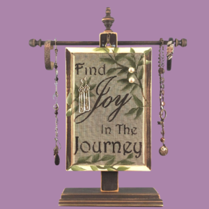 Hand-painted Earring Holder — Classic Series Joy in the Journey Design on two tone black and white distressed solid wood frame with a fiberglass earring display screen hanging on necklace stand. Handmade in Michigan.